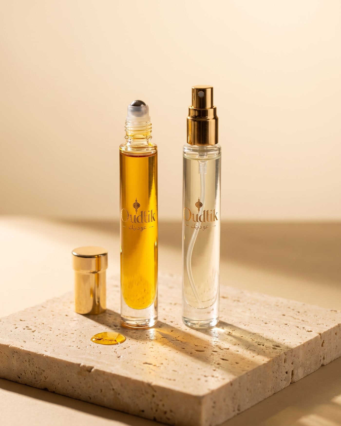 Oudtik pure oil roll-on beside its perfume spray